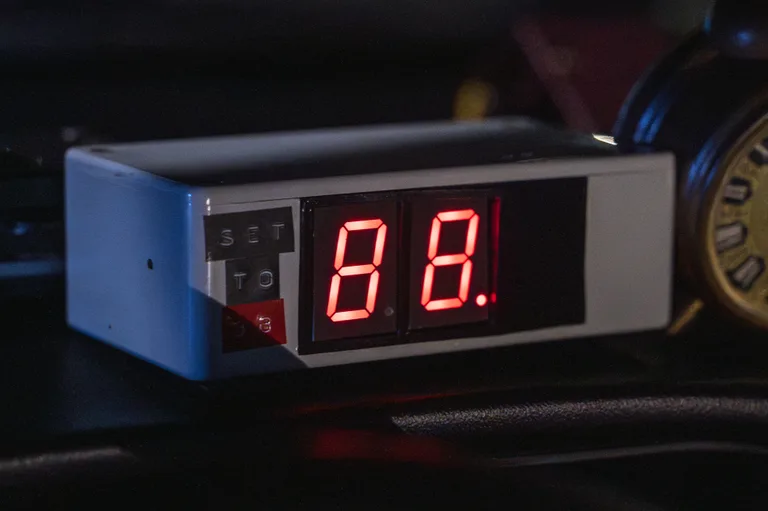Time circuit display close-up showing red 7-segment digits — DeLorean Time Machine interior detail